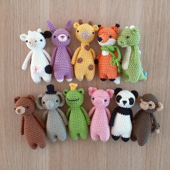 Two rows of eleven crocheted animals from the MINI Series PDF Crochet Amigurumi Patterns BUNDLE